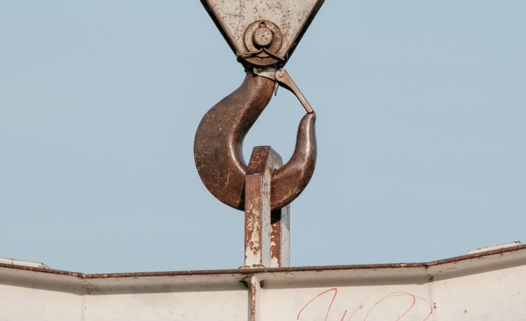 closeup of a crane hook holding something heavy